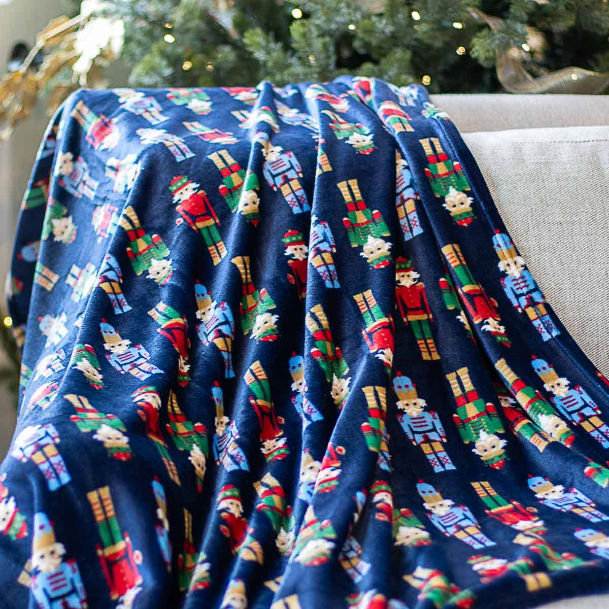 The Royal Standard Nutcracker March Throw Navy Multi 50x60 The Oaks Apparel Co