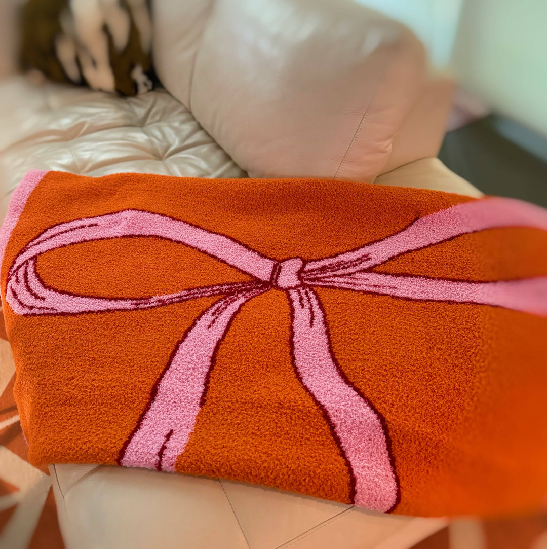 Ellison+Young - My Only Bow Coziest Blanket: Orange/Pink
