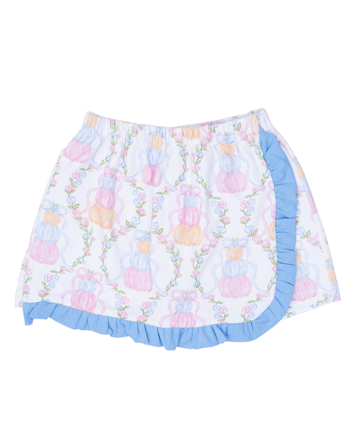 Floral patterned skirt with ruffled edge on a white background