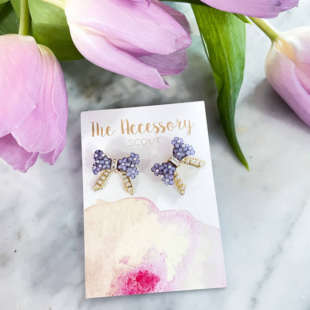THE ACCESSORY SCOUT - Lavender Flower Bow Studs